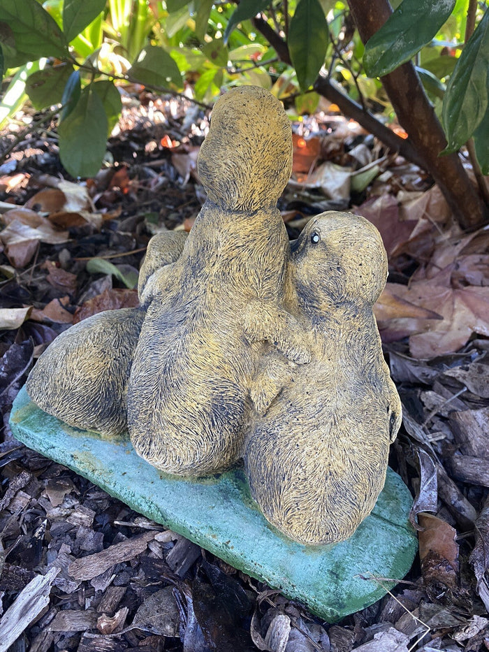 22nice4me Garden Statues set of three hand-painted concrete ducklings with a textured matte finish in a garden setting